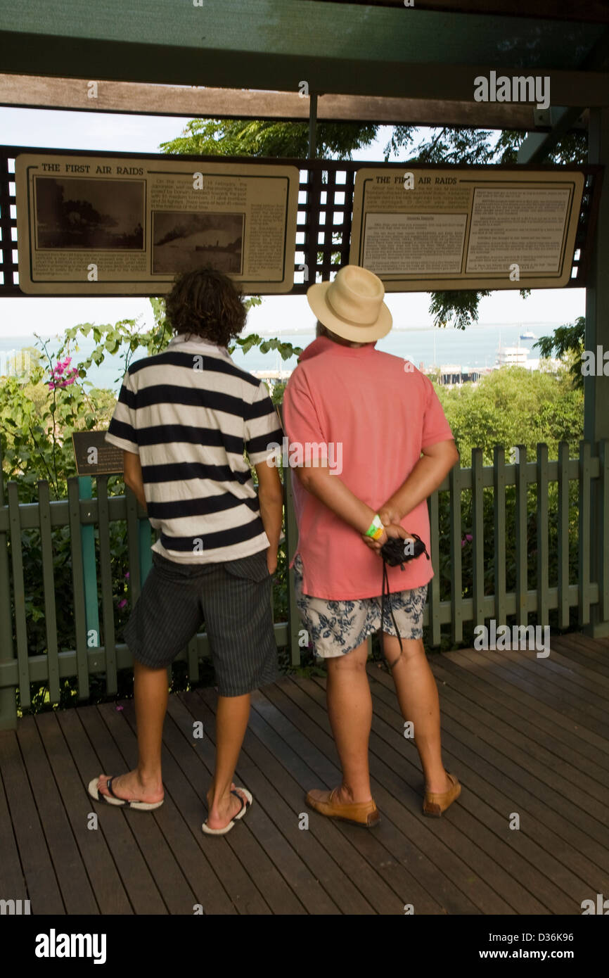 Visitors view a sequence of historic World War II photos and documents on display along the Esplanade in Darwin, NT, Australia. Stock Photo