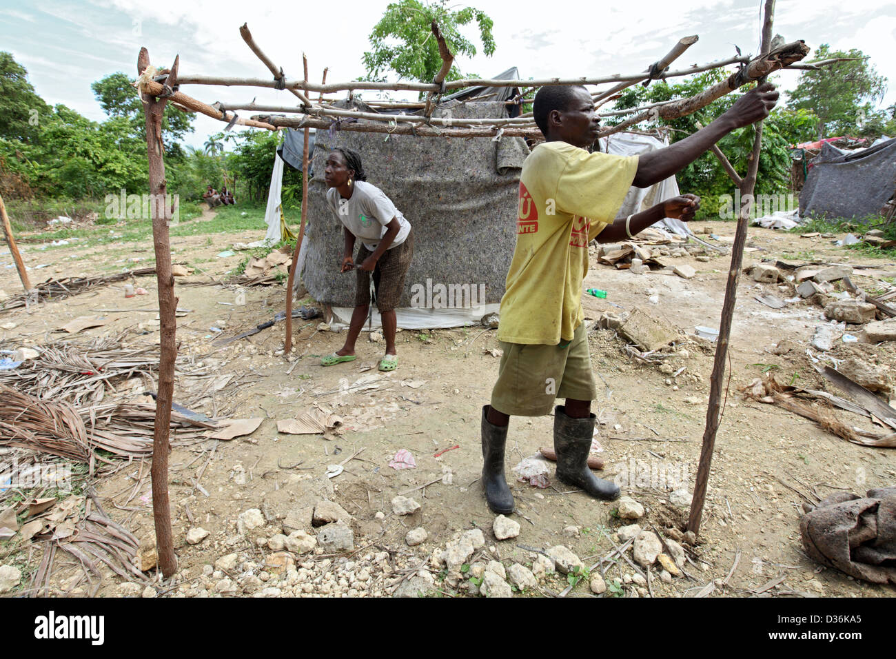 Leogane, Haiti, earthquake victims at a refugee camp build a shelter