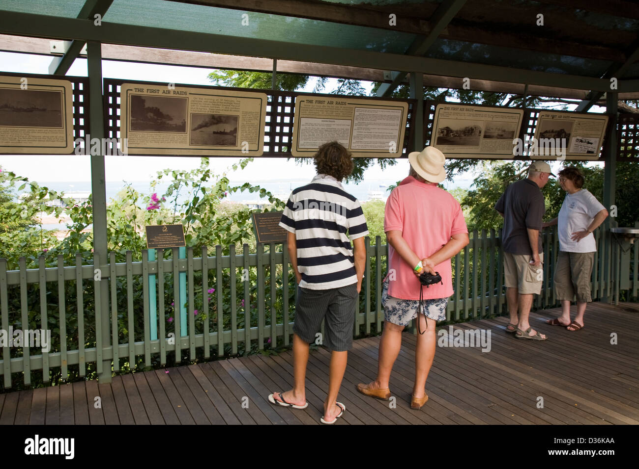 Visitors view a sequence of historic World War II photos and documents on display along the Esplanade in Darwin, NT, Australia. Stock Photo