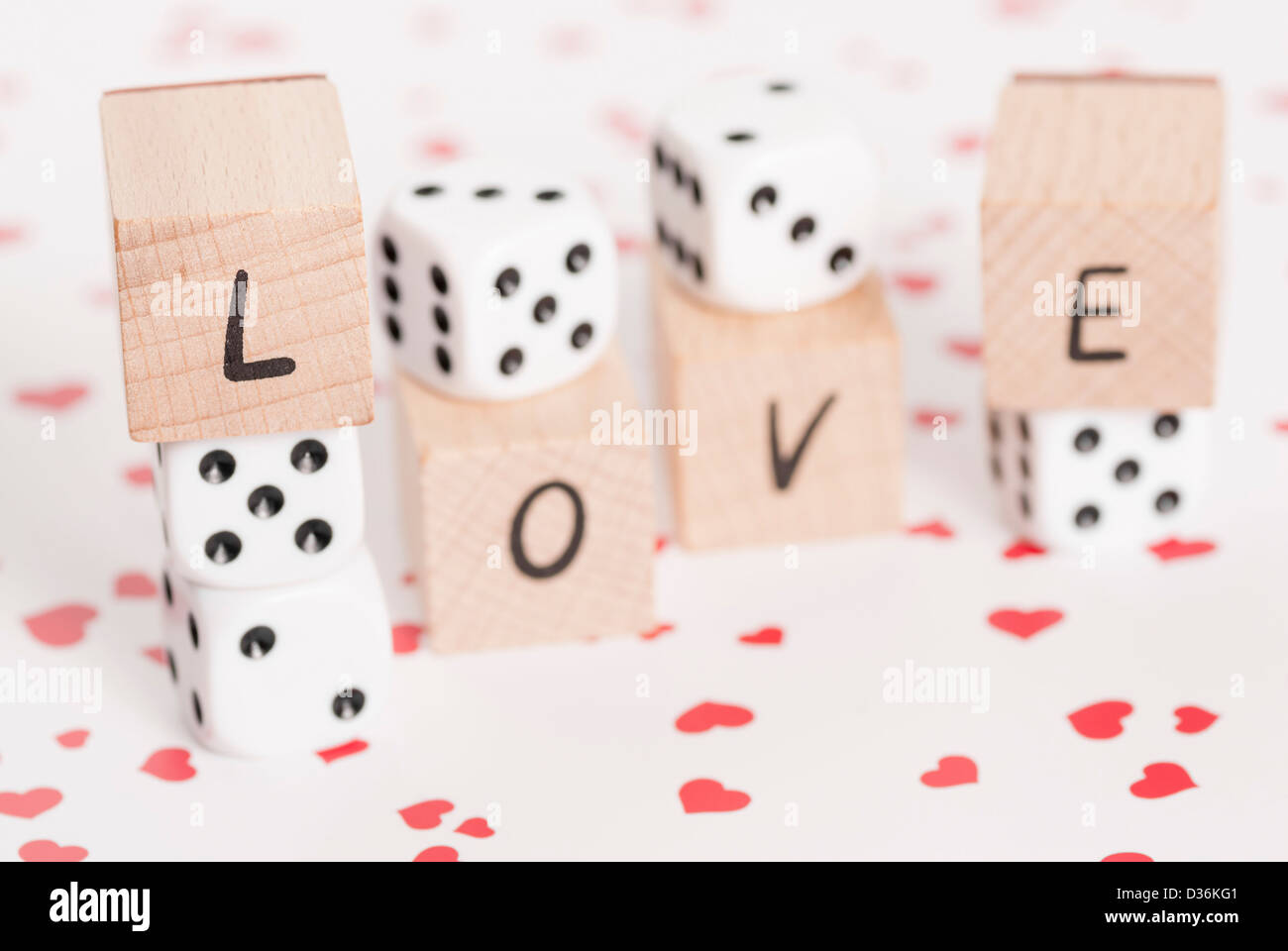 The word love alongside white dice Stock Photo - Alamy
