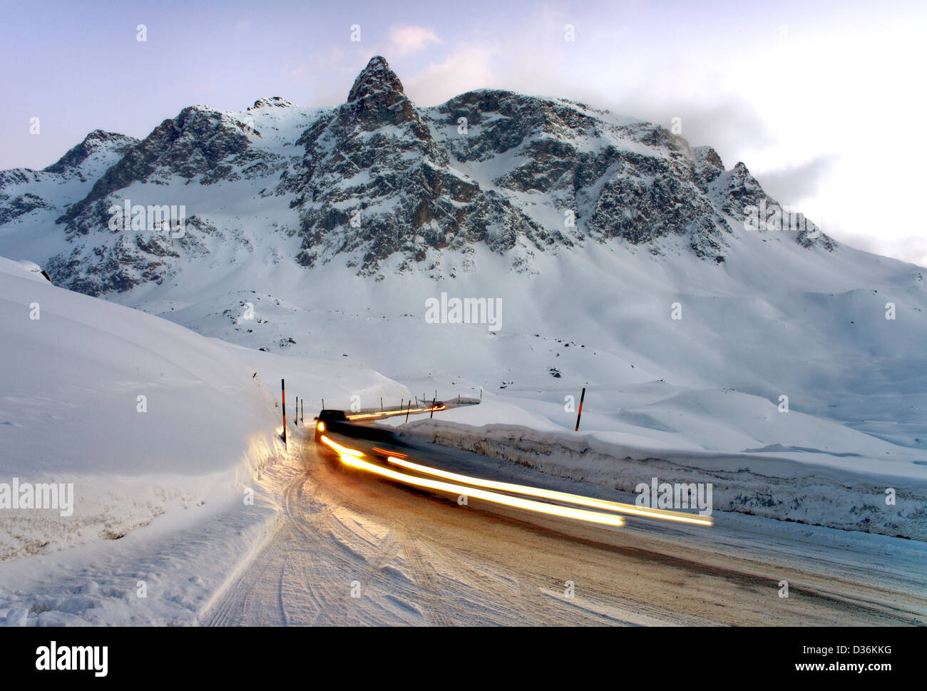 Winter traffic with light trails at Julier Pass, Engadin, Switzerland Stock Photo