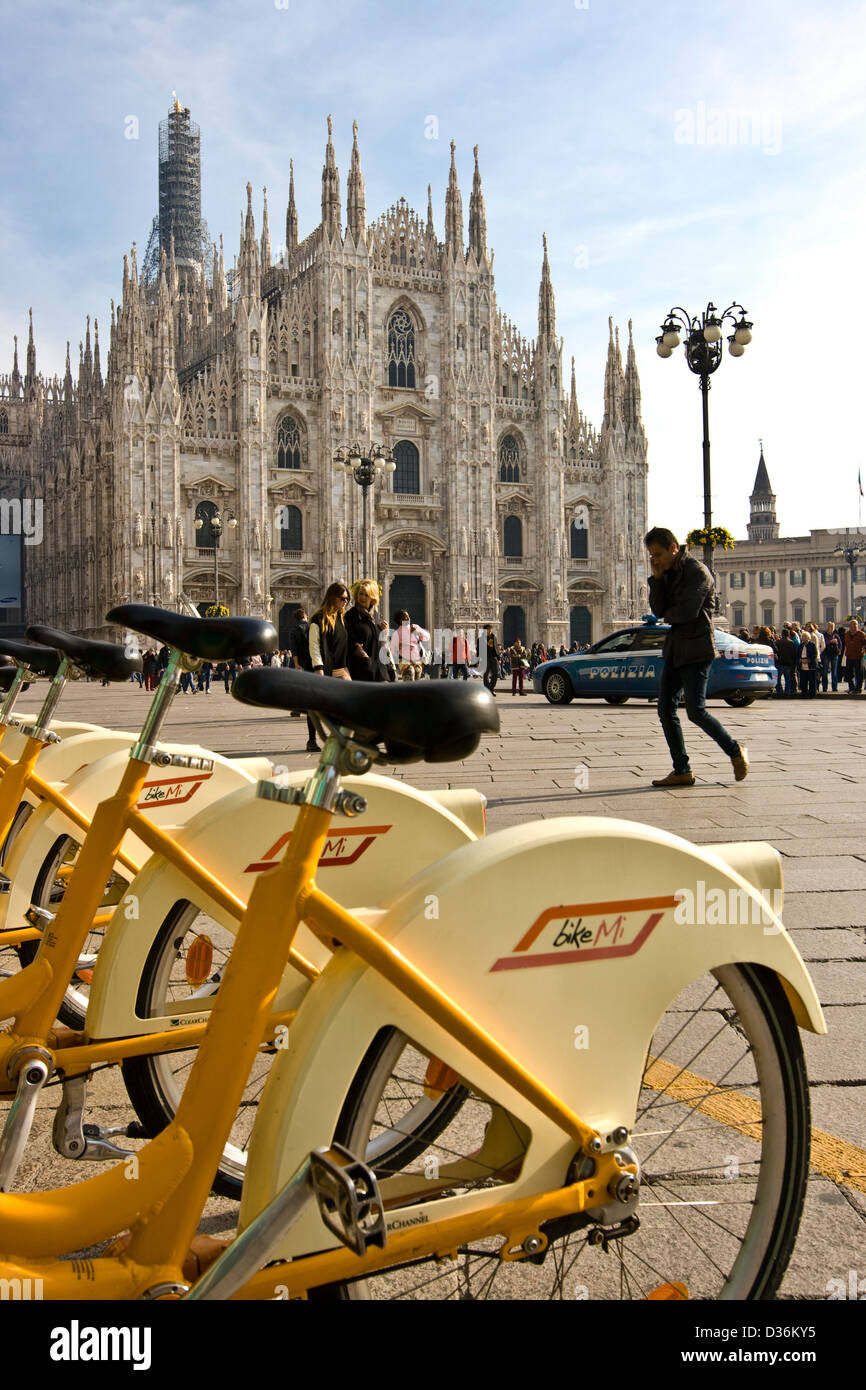 Milan Cathedral and Bike Mi bikes Milan's bicycle rental system Piazza Duomo Milan Lombardy Italy Europe Stock Photo