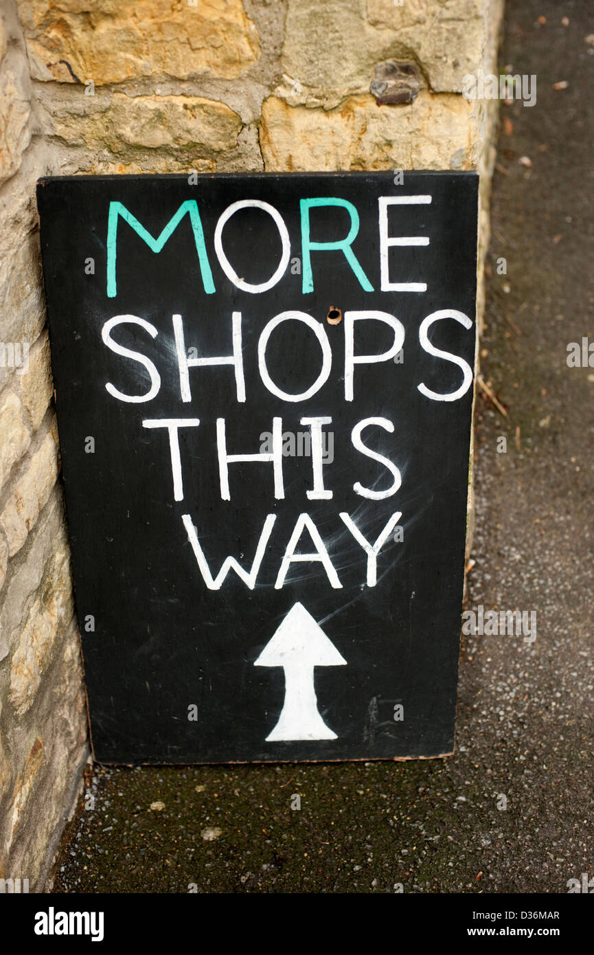 More Shops This Way sign White Black Chalk Board Stock Photo