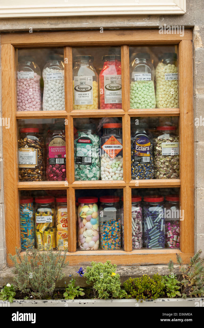 Old Traditional jars of sweets in shop window Stock Photo