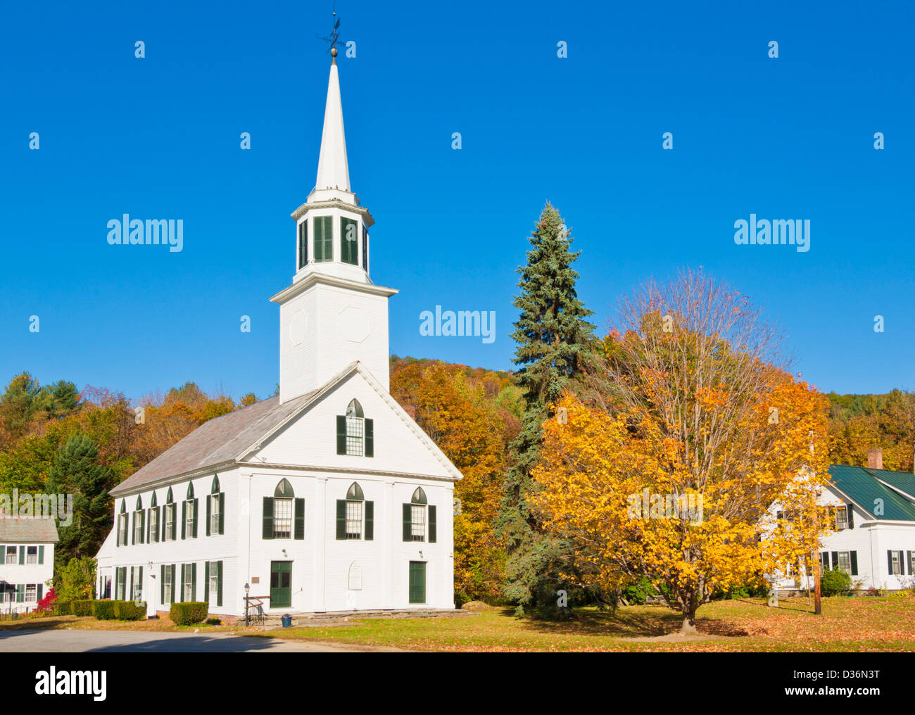 Autumn colours around the traditional white timber clad church Townshend Vermont United States of America USA Stock Photo