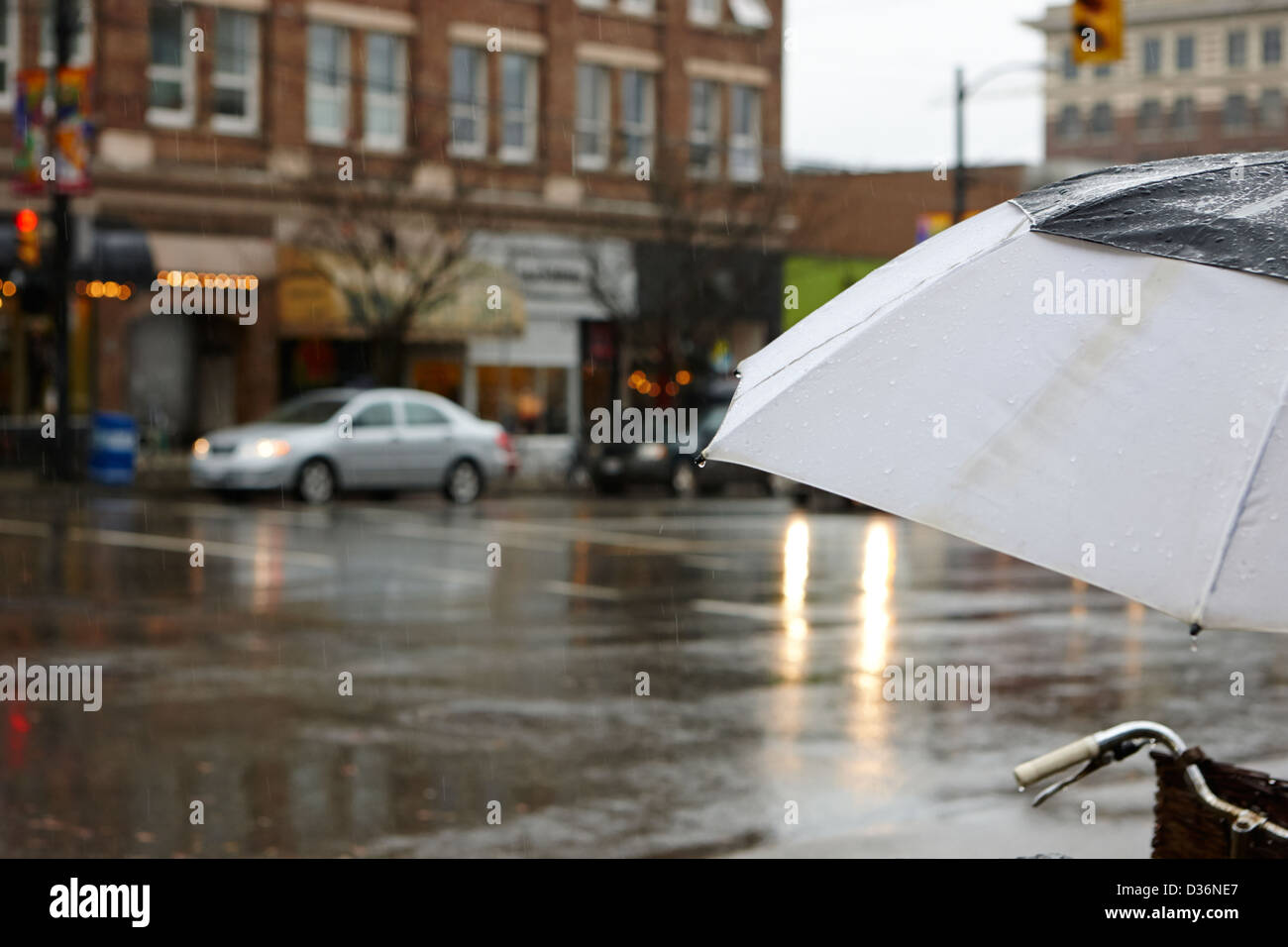 rain falling off a umbrella on a wet rainy day in downtown Vancouver BC