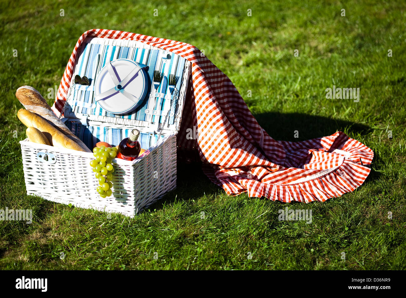 Picnic basket with fruit bread and wine Stock Photo - Alamy