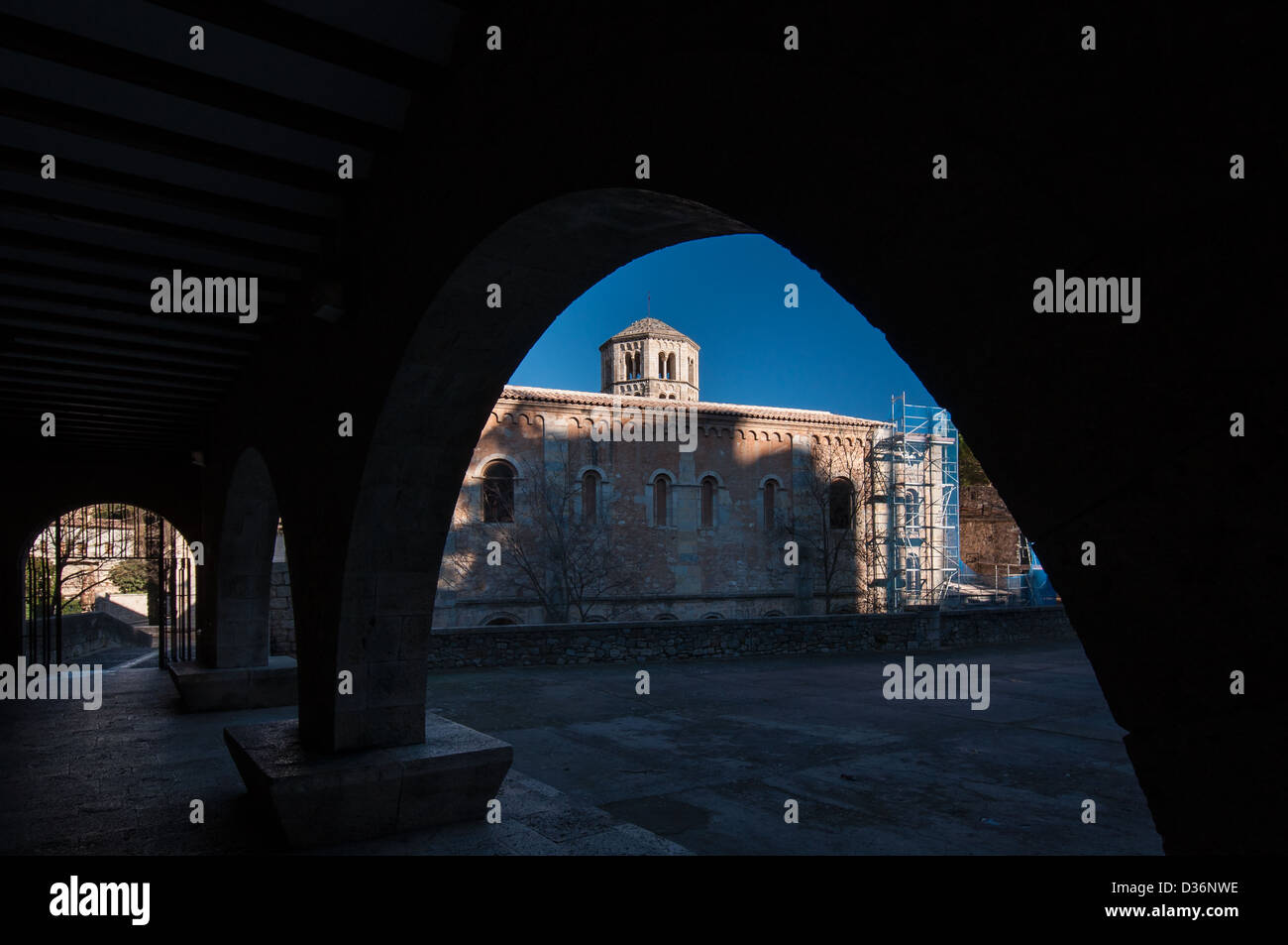 Sant Pere de Galligants viewed through arches in Girona city center. Catalonia, Spain. Stock Photo