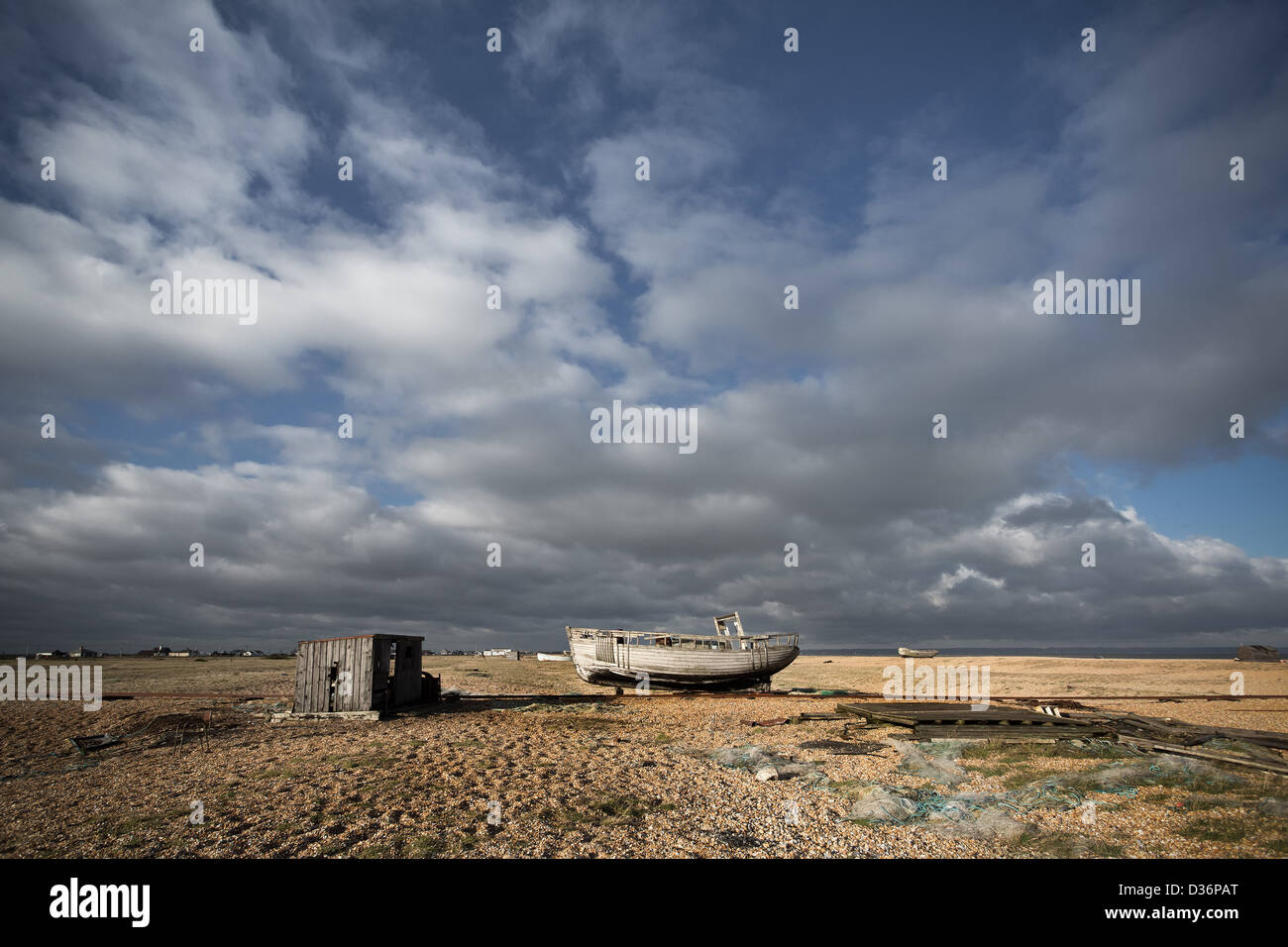 Abandoned fishing boat on the shingle at Dungeness in Kent Stock Photo ...