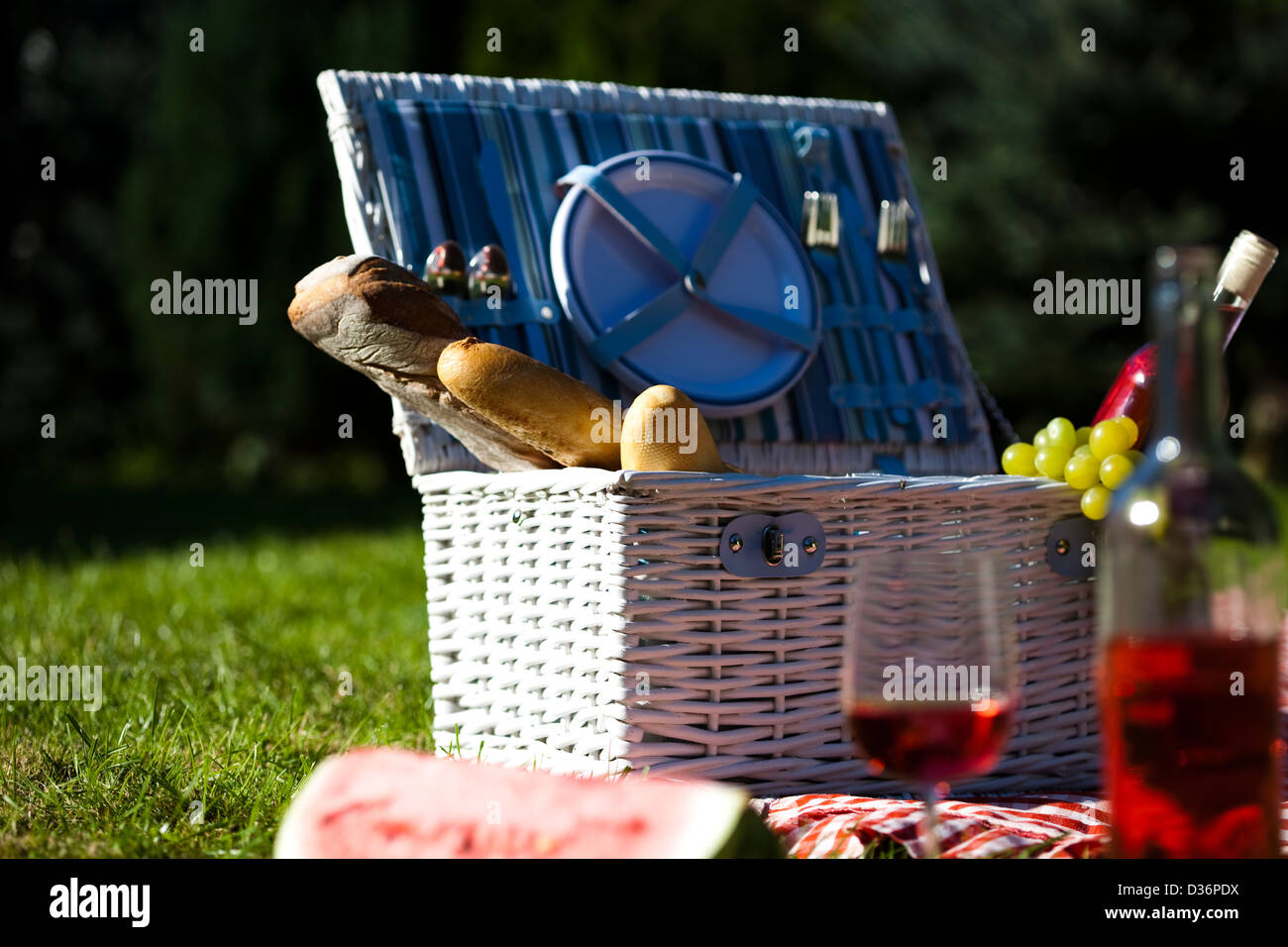 Picnic basket with fruit bread and wine Stock Photo - Alamy