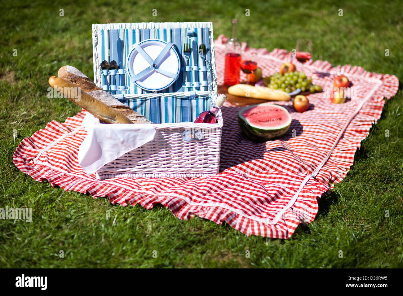 Picnic basket with fruit bread and wine Stock Photo - Alamy