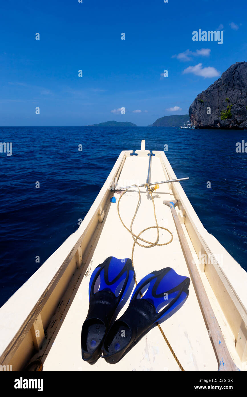 Go to deep sea - flipper on the boat Stock Photo