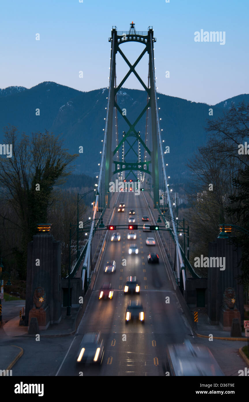 Evening shot of Vancouver's Lions Gate Bridge showing traffic in motion. Stock Photo