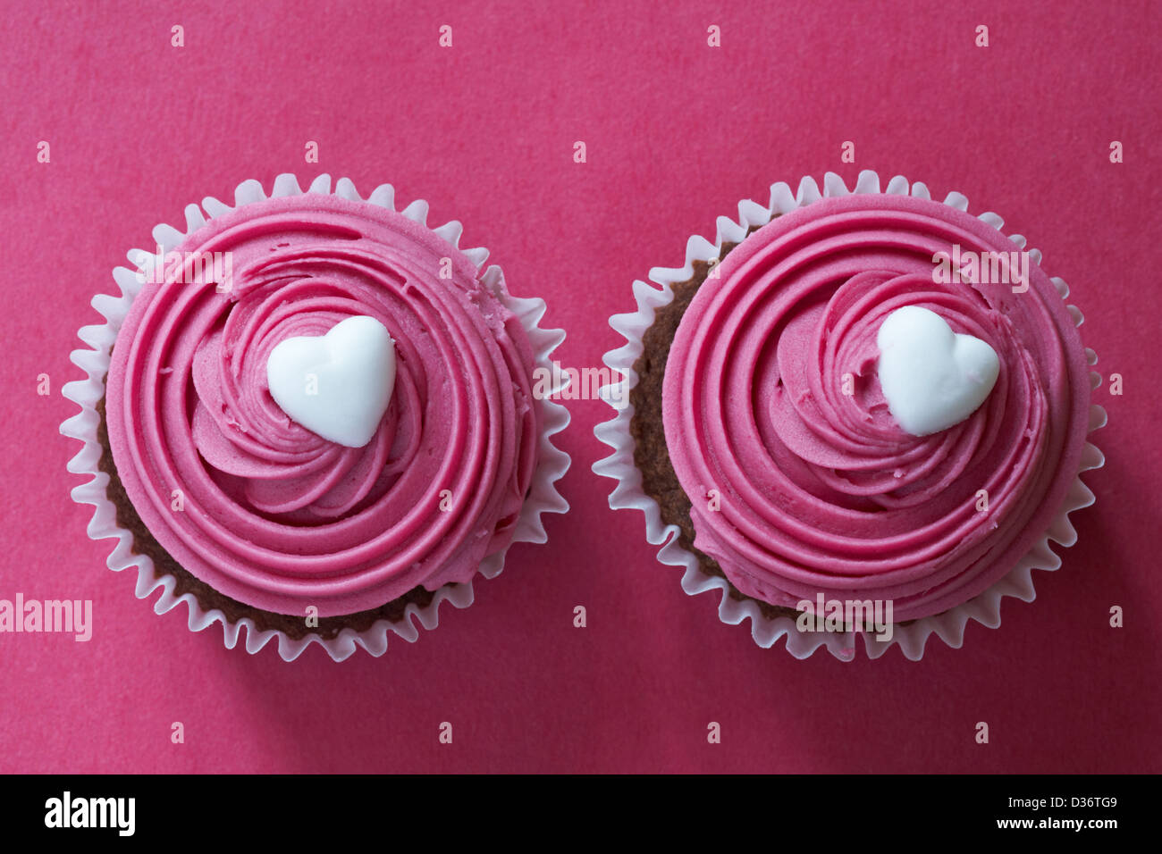 two hello cupcake cupcakes isolated on pink background - ideal for Valentines day, Valentine day Stock Photo