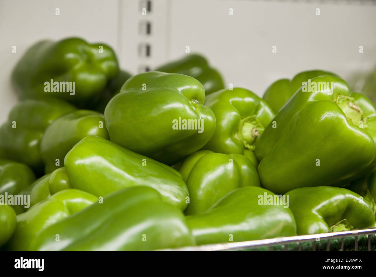 green peppers in a bin at the farmer's market, ready for sale Stock Photo