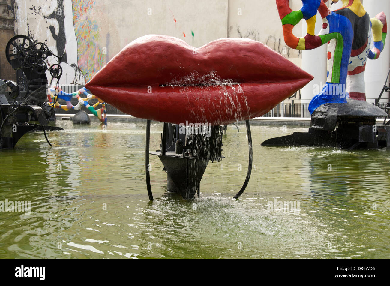 This huge pair of red lips called L’Amour by artists Jean Tinguely and Niki de Saint Phalle, is part of the Stravinsky fountain in Paris, France. Stock Photo