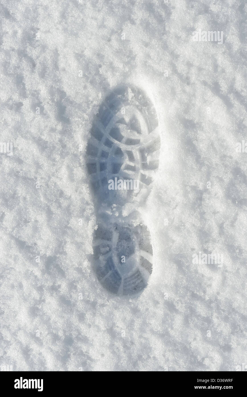 Boot footprint in fresh snow Stock Photo