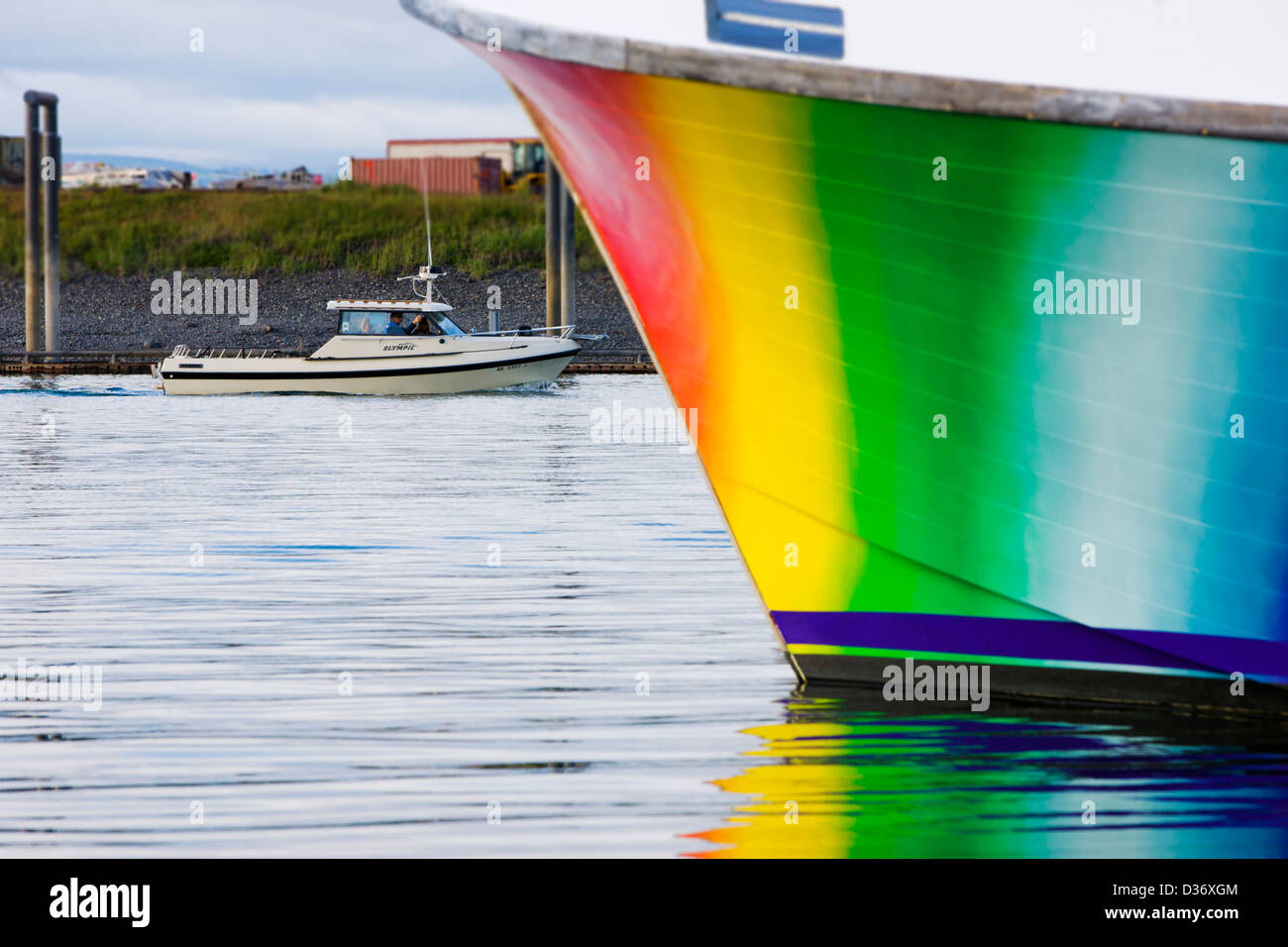 Charter and commercial fishing boats in the harbor, Homer, Alaska, USA, Colorful hull of the Rainbow Connection charter boat. Stock Photo