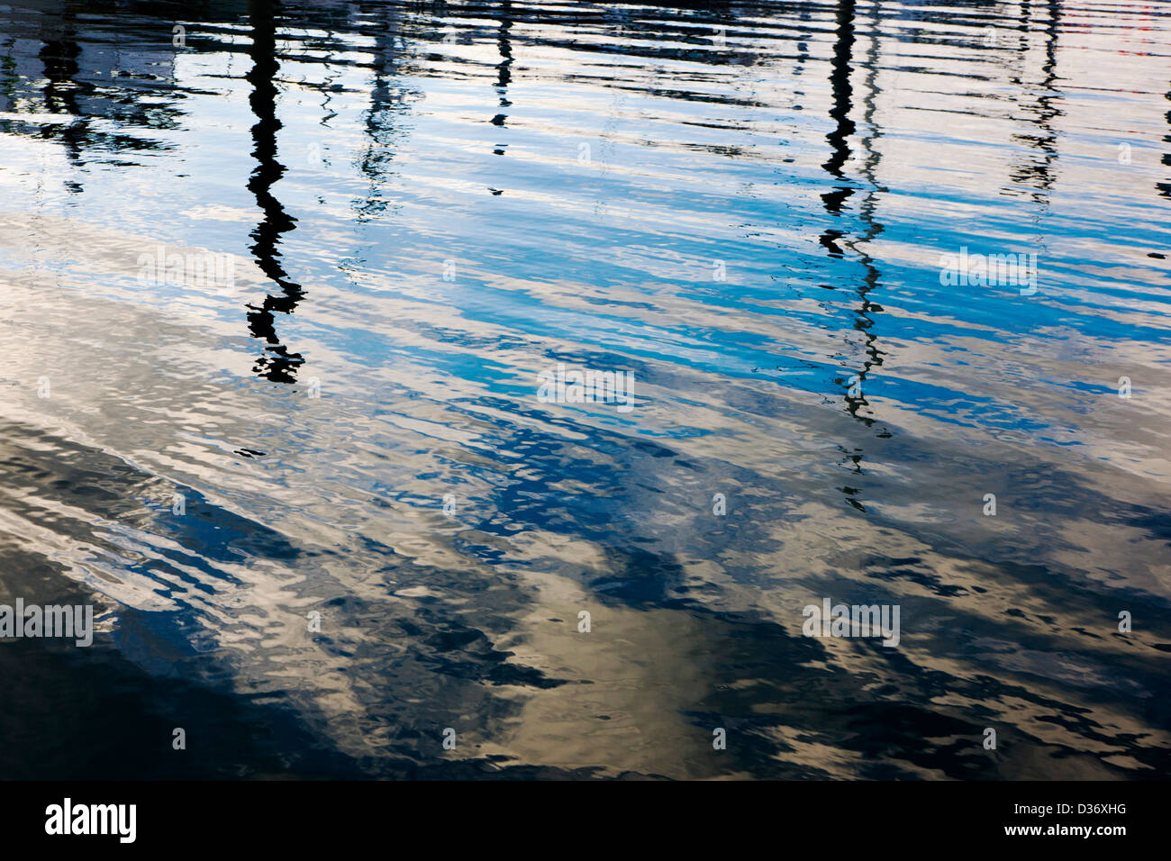 Water ripples reflect the dusk sky, harbor, Homer, Alaska, USA Stock Photo