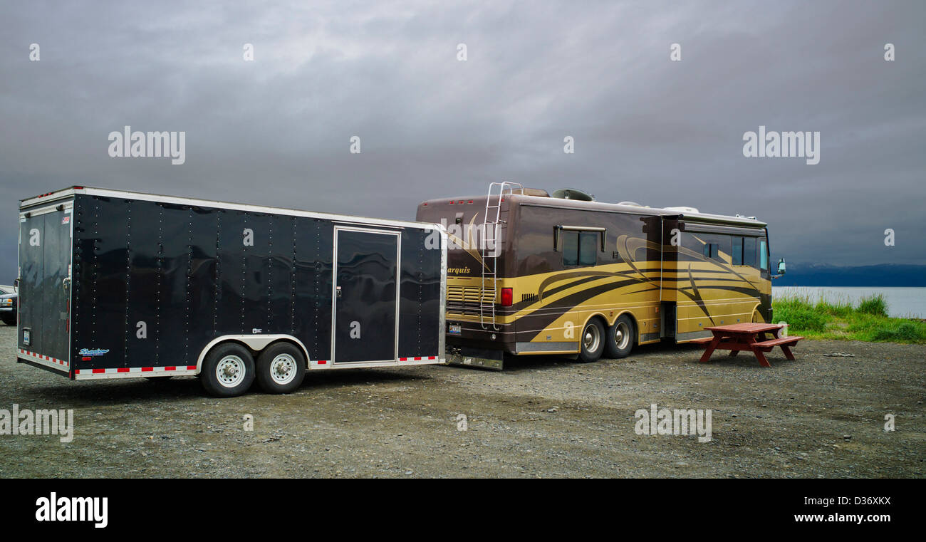 Huge recreational vehicle with a trailer camped at Homer Spit, Homer, Alaska, USA Stock Photo