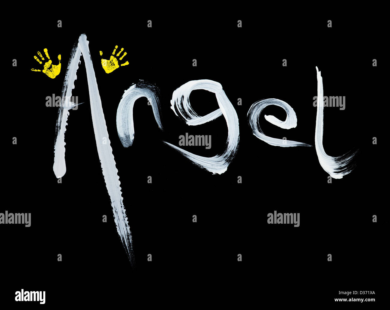 Painted Angel word with hand prints as wings on black background Stock Photo