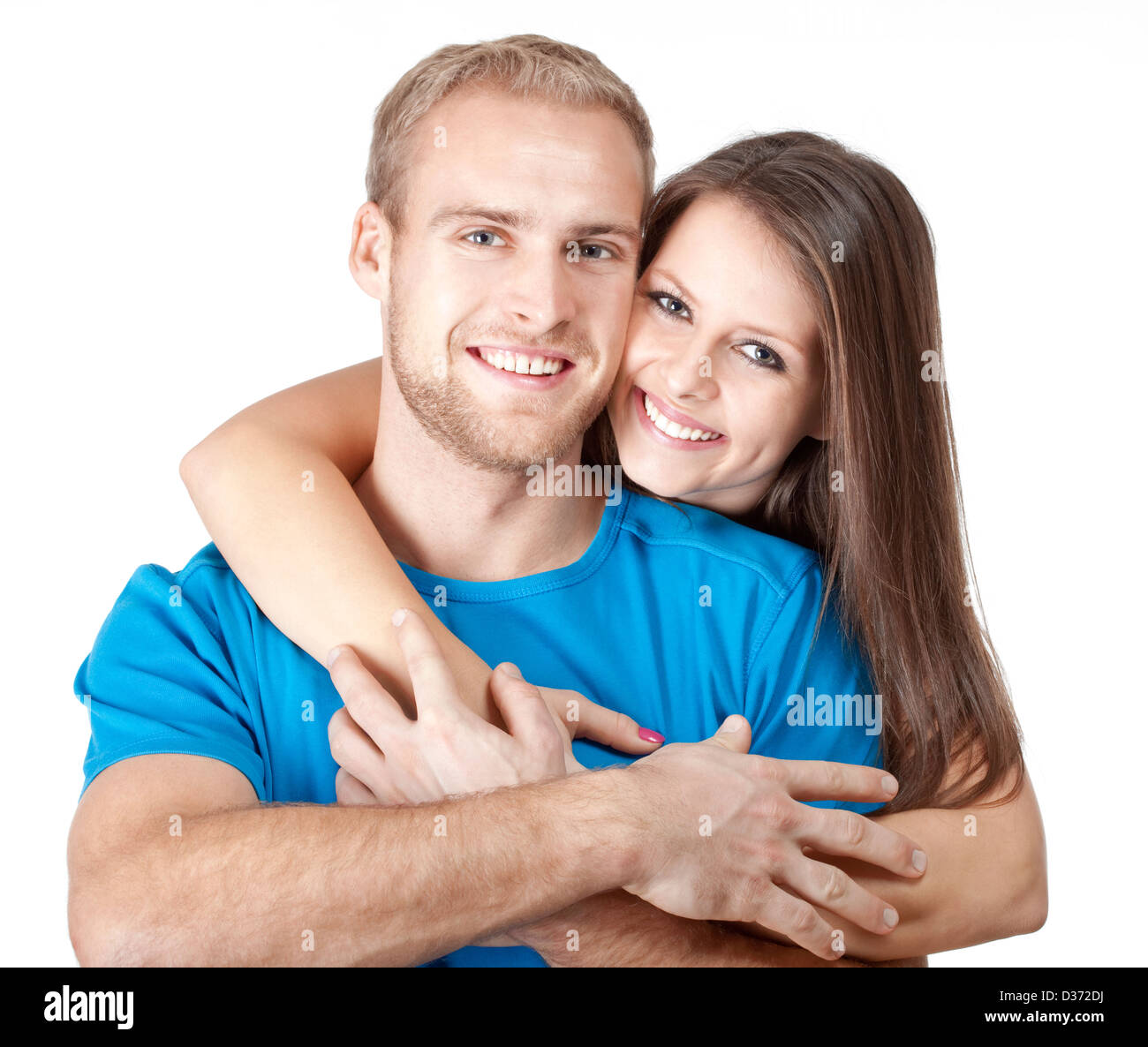 portrait of a happy young couple smiling Stock Photo - Alamy