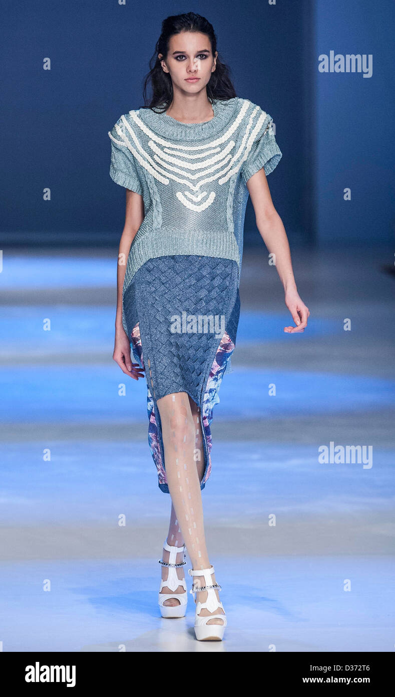 A model showcases designs on the runway by Cheung Ming Han Joyce's Blue and White Porcelain show during the Hong Kong Fashion De Stock Photo