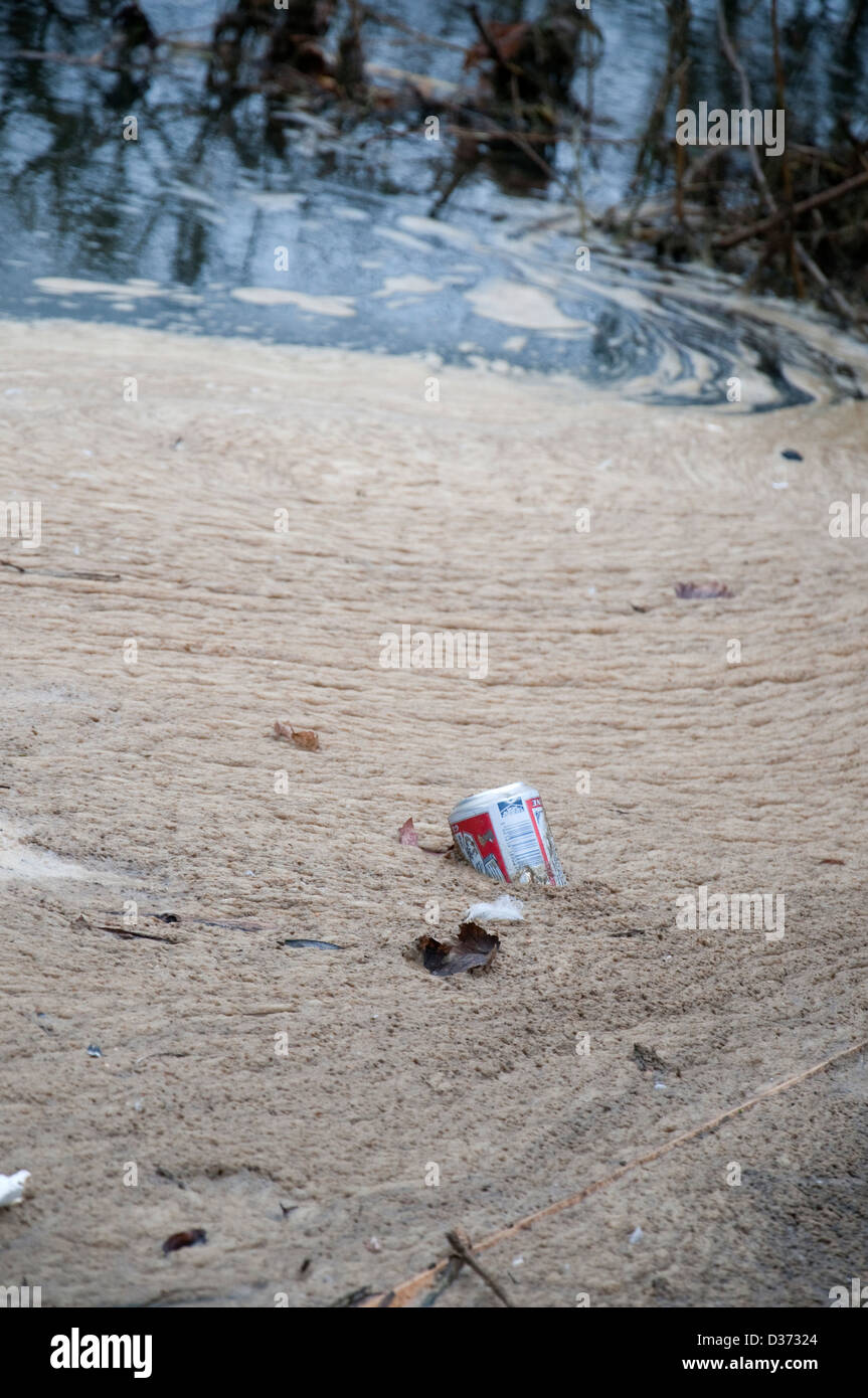 Beer Rings Polution Beer can surrounded by polluted water Stock Photo - Alamy