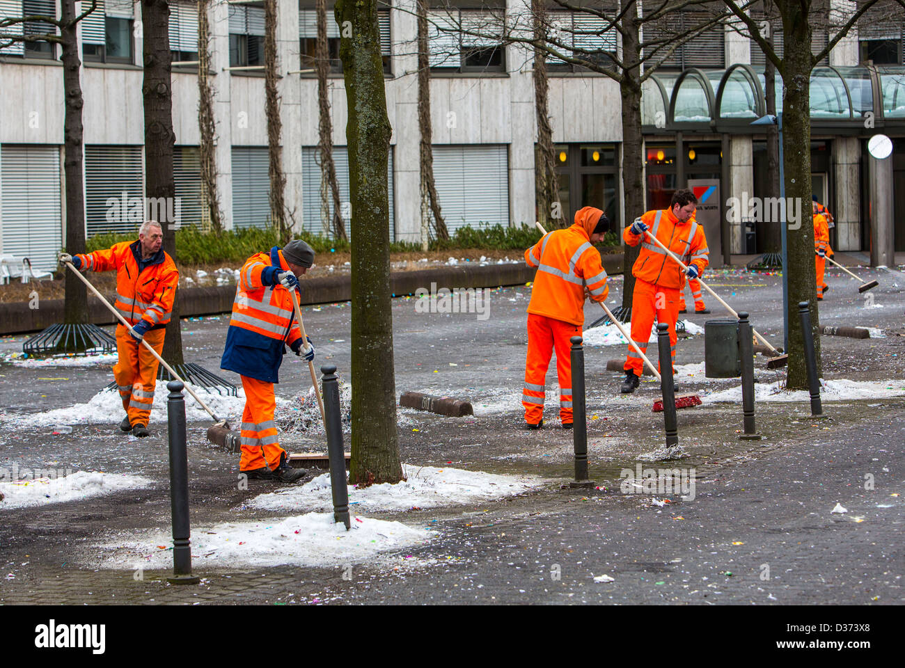 Municipal cleaning services, after a carnival parade, cleaning the street. Stock Photo