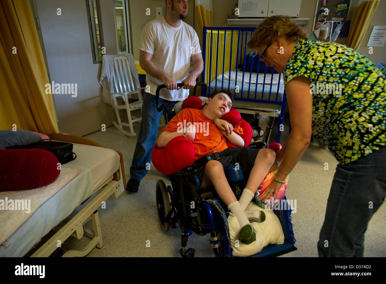 Jan 20, 2013 - Montgomery, Alabama, U.S. - Nola Sayne's disabled son Zach was only ten years old when she was forced to make the gut-wrenching decision to place him in a nursing home. She was unable to find a facility in Georgia where they lived. The closest skilled-care facility that would accept him was 200 miles away from home.Nola thought about quitting her job as a paralegal, but she was a single mother then with two kids. She needed her salary, and she needed the health insurance for Zach. The state of Georgia would pay nothing if Zach lived at home. But it offered to pay the full cost o Stock Photo