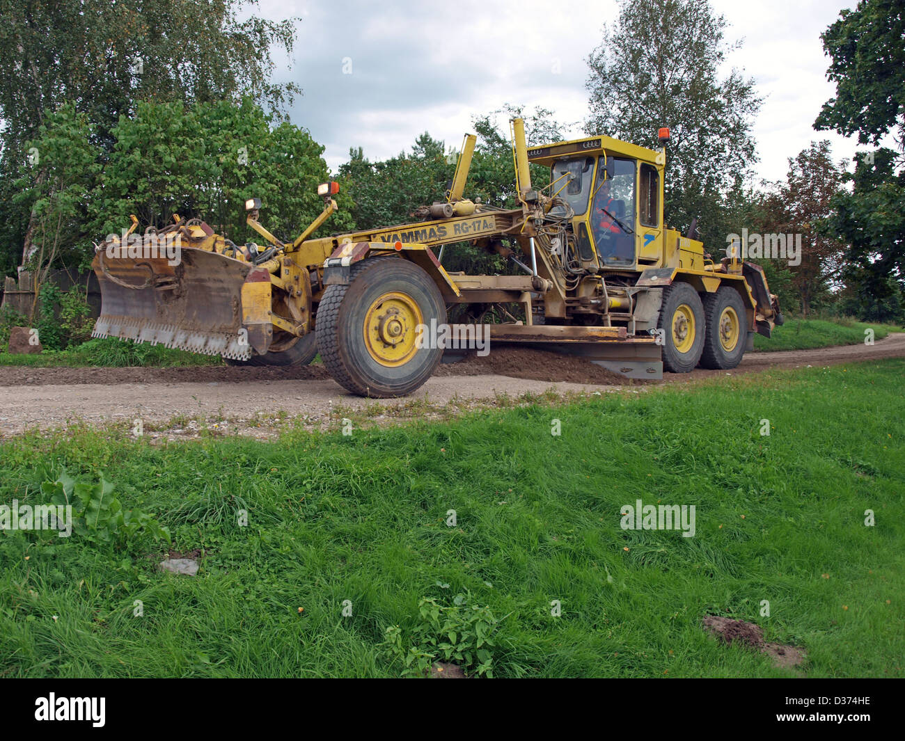 Grader planed down gravel country road Stock Photo