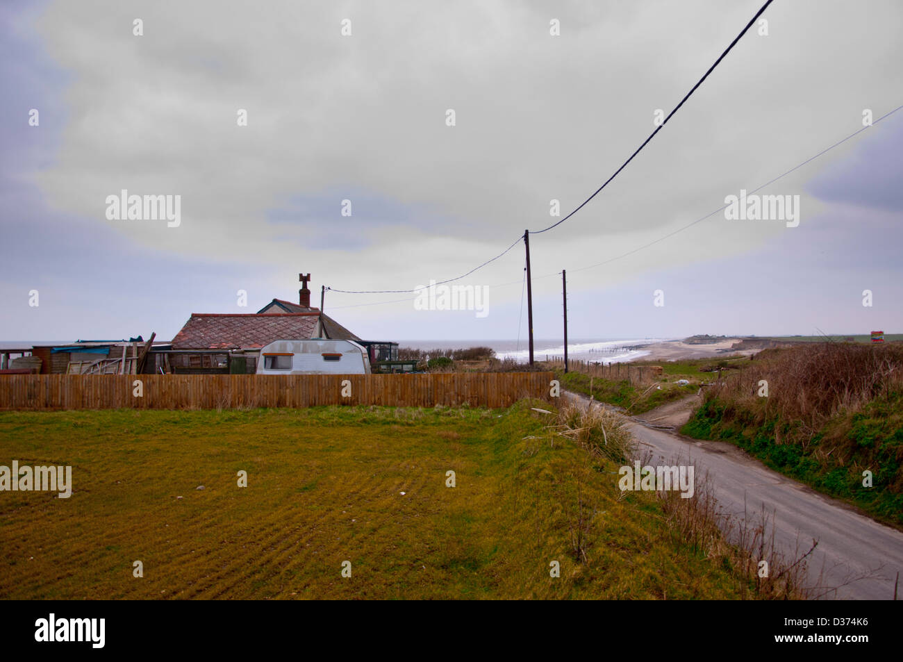 The last remaining house at the end of beach road Happisburgh Stock