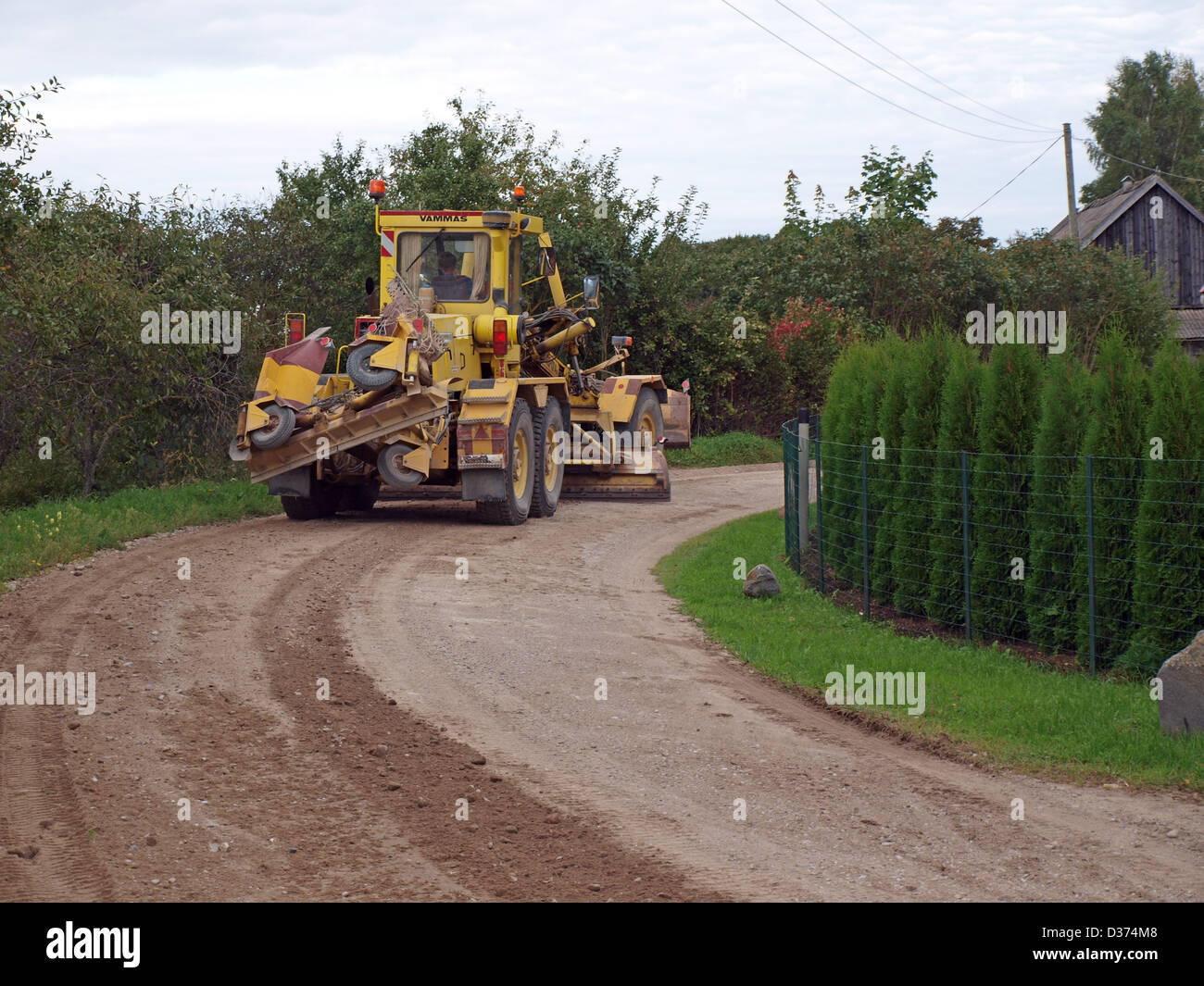 Grader planed down gravel country road Stock Photo