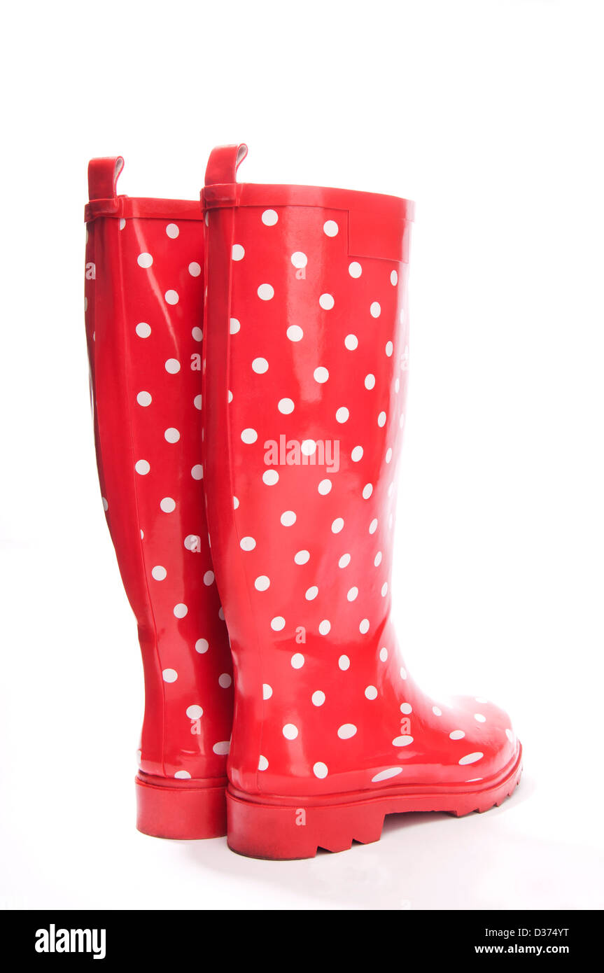 Red gumboots with white polka dot from the back Stock Photo