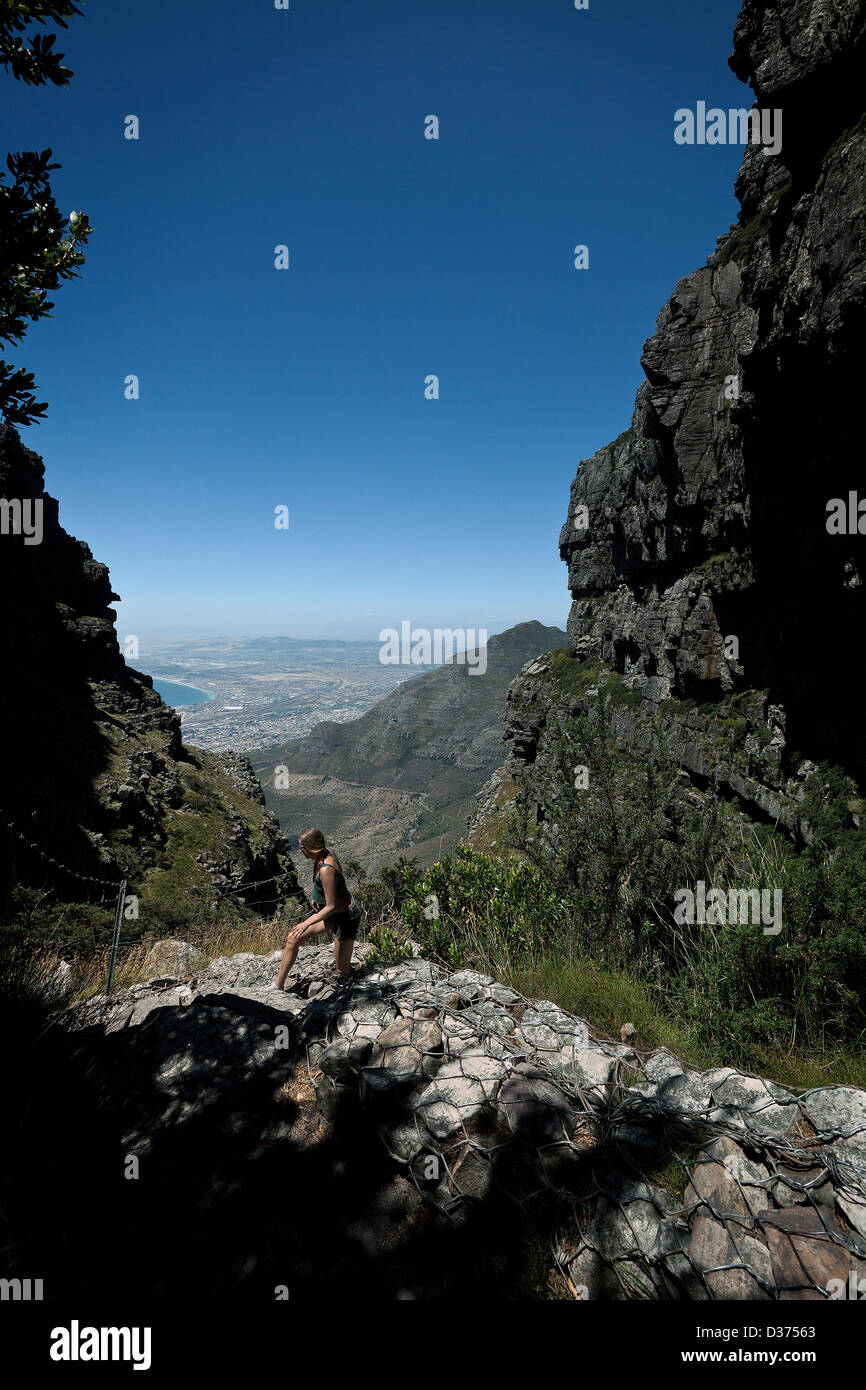 A female hiker photographed between Table Mountain, with the Cape Town CBD in the background. Stock Photo
