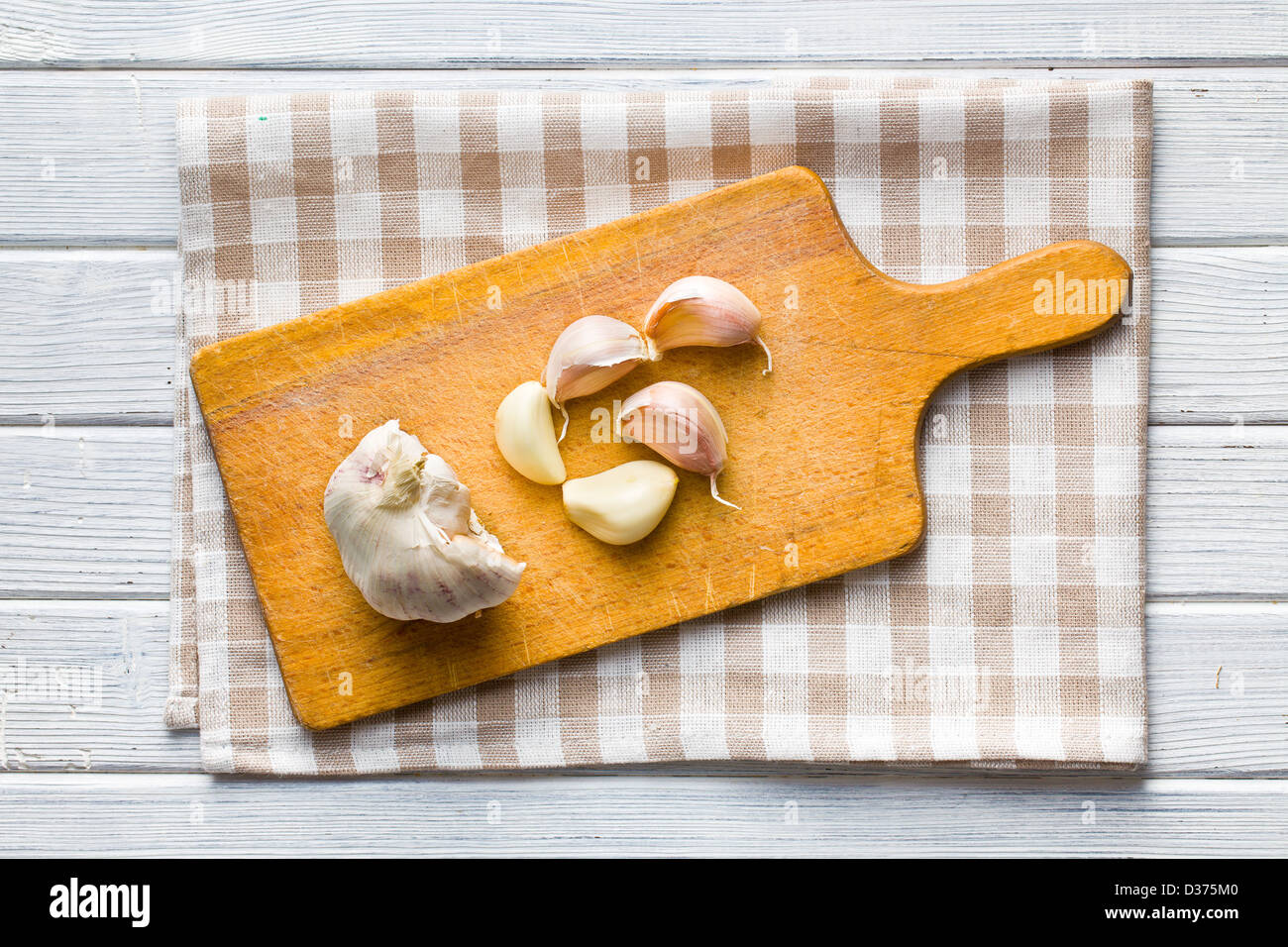 the fresh garlic on kitchen table Stock Photo