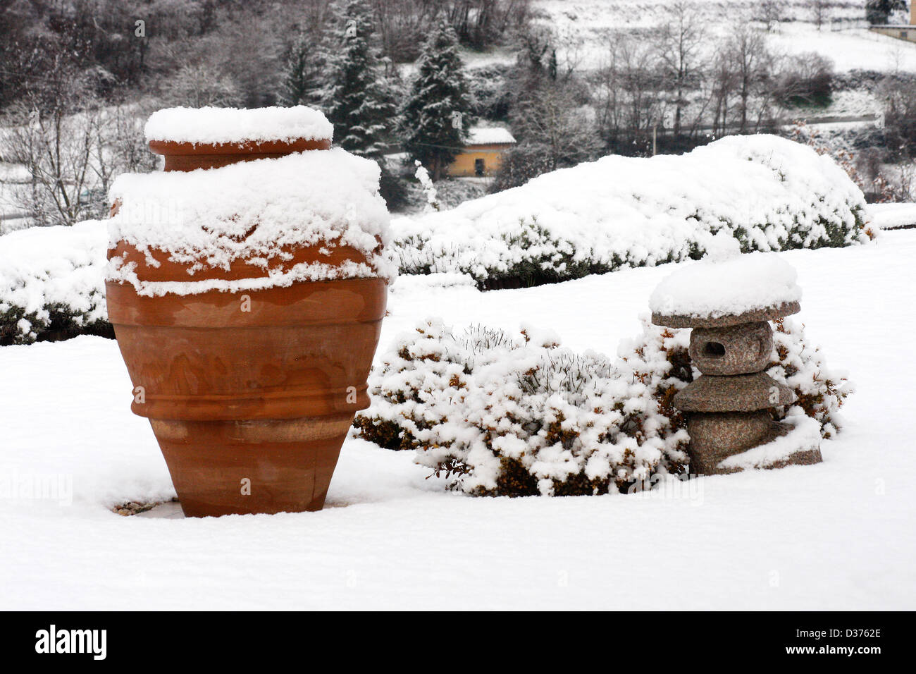 Garden ornaments covered with snow. Stock Photo
