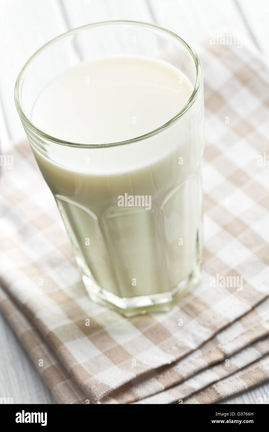 the glass of milk on wooden table Stock Photo - Alamy