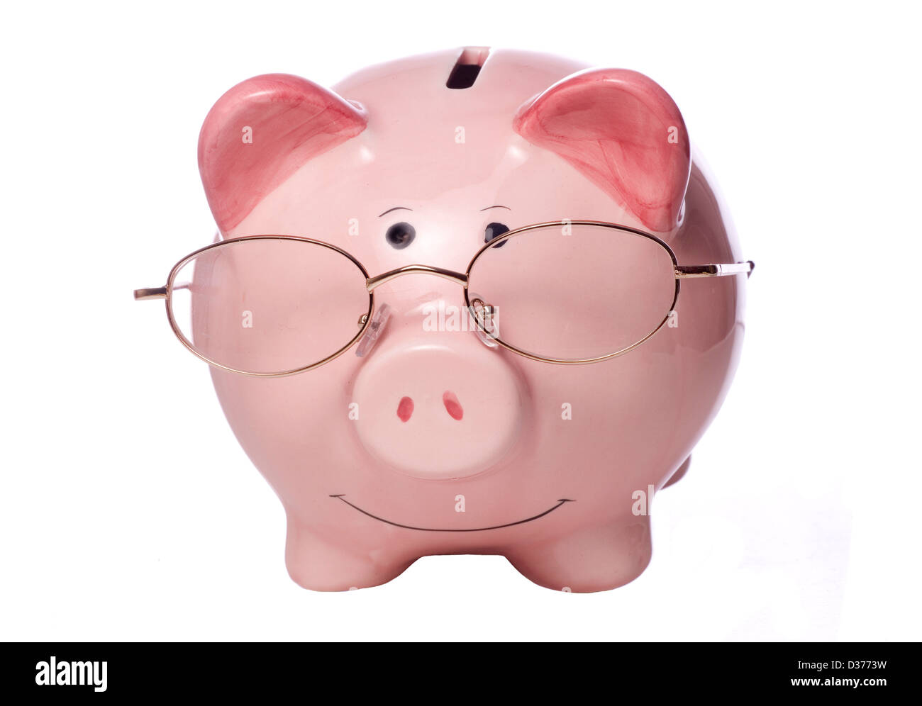 piggy bank with glasses studio cutout Stock Photo