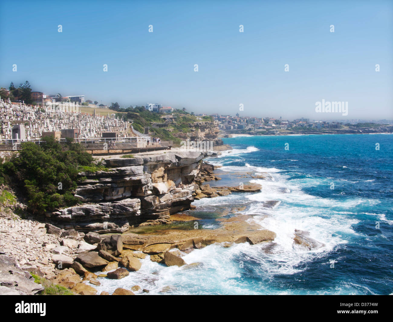 A portion of the Bondi to Coogee Walk with sea and waves on a sunny day. Stock Photo
