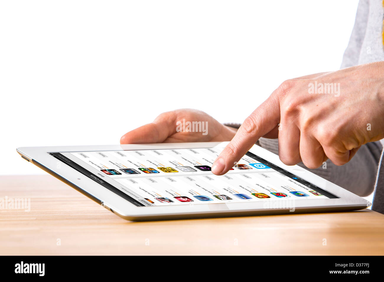 Person is using a tablet computer. Itunes, music, software Internet store. Stock Photo