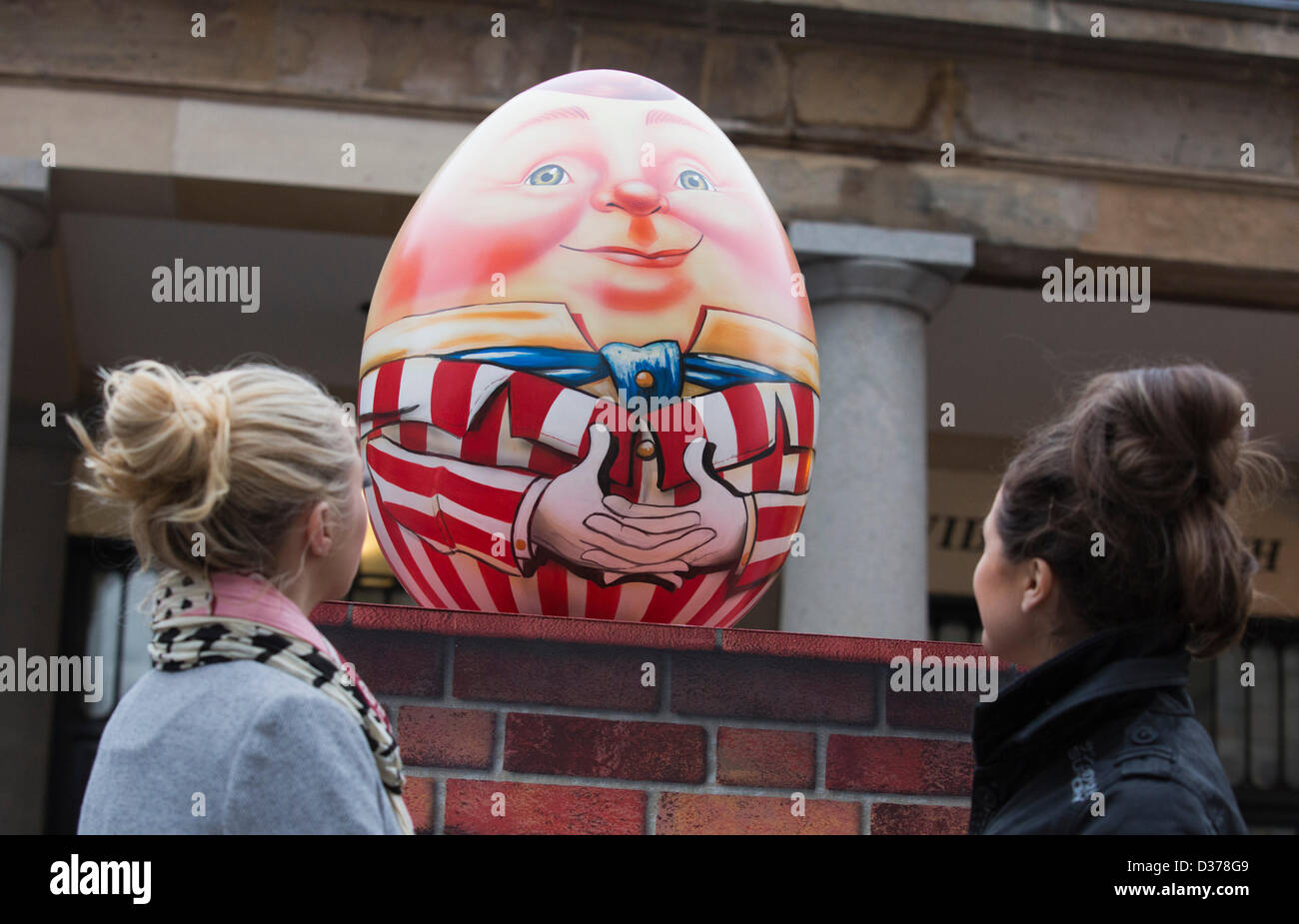 London, UK. 12th February 2013.  Veronica Fulton, 21, and Imogen Money, 22, from London admire the eggs. Over 100 giant Easter eggs designed by artists and designers were unveiled today in Covent Garden Piazza, London, to launch The Lindt Big Egg Hunt in support for the charity 'Action for Children'. For six weeks, from 12 February to 1 April 2013, giant Easter eggs will tour the country, from London's Covent Garden to Birmingham, Liverpool, Manchester, Glasgow and back to London in time for Easter. Photo: Nick Savage/Alamy Live News Stock Photo