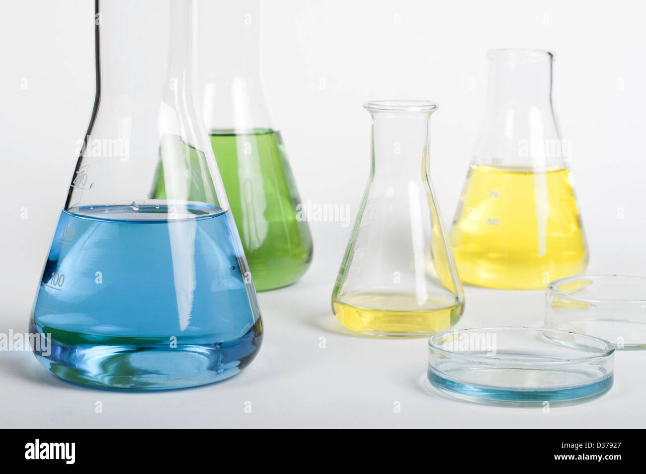 Laboratory glassware equipment. Laboratory beakers filled with colored liquid substances Stock Photo