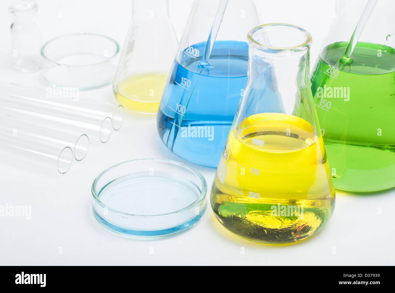 Laboratory glassware equipment. Laboratory beakers filled with colored liquid substances Stock Photo