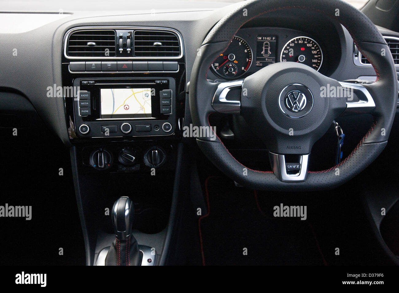 Drivers controls and steering wheel in the VW Volkswagen Polo GTI,  Winchester, England, 15 03 2011 Stock Photo - Alamy