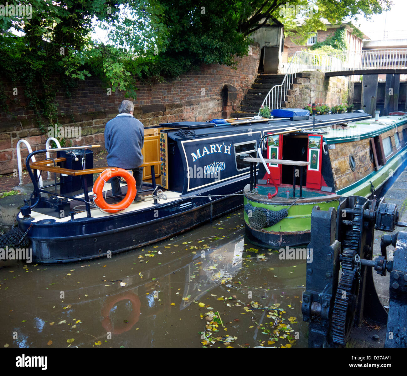 Barges passing through Chester canal locks. Stock Photo