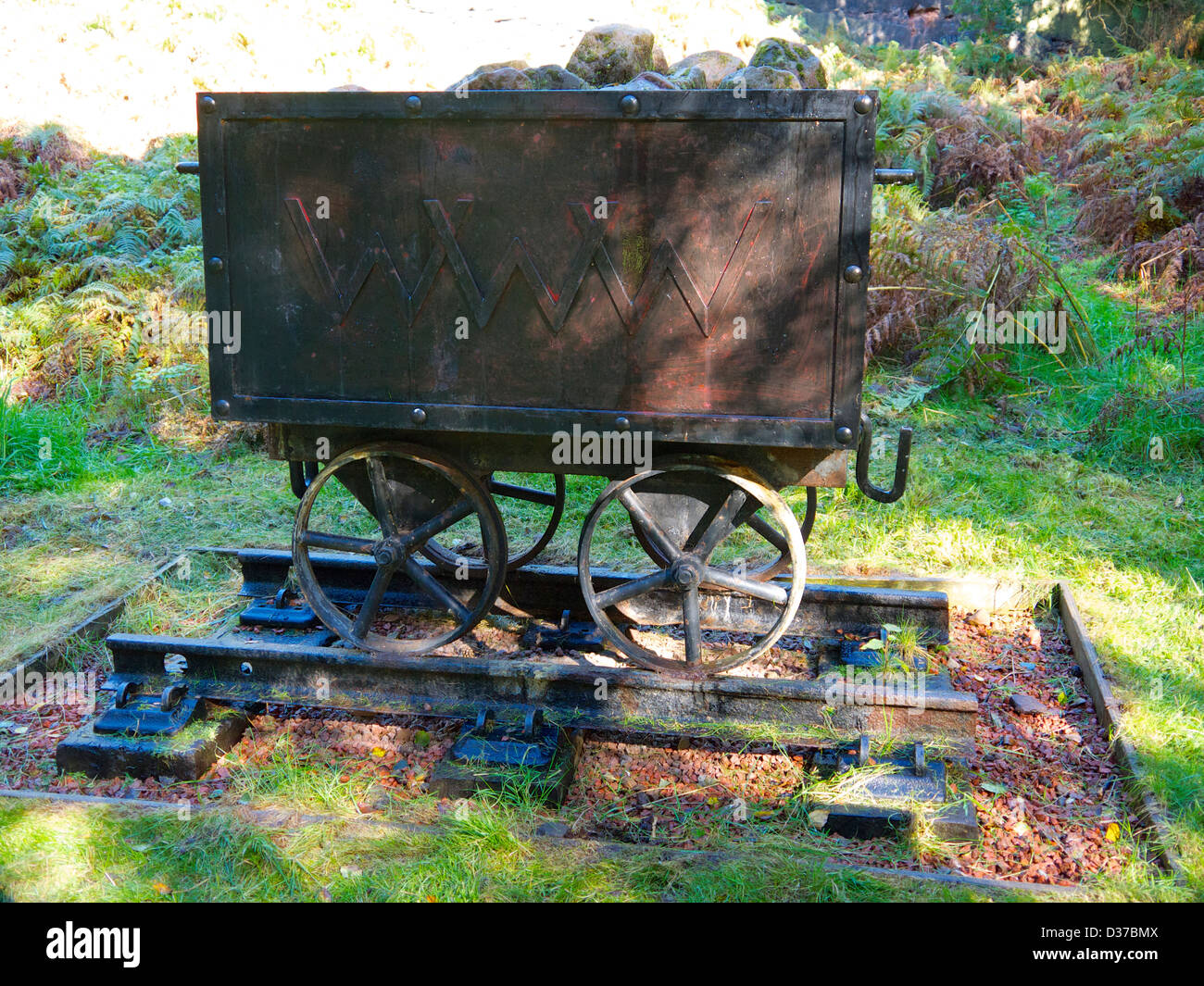 Old mine cart for carrying rocks out of the mines in Runcorn hills. Stock Photo