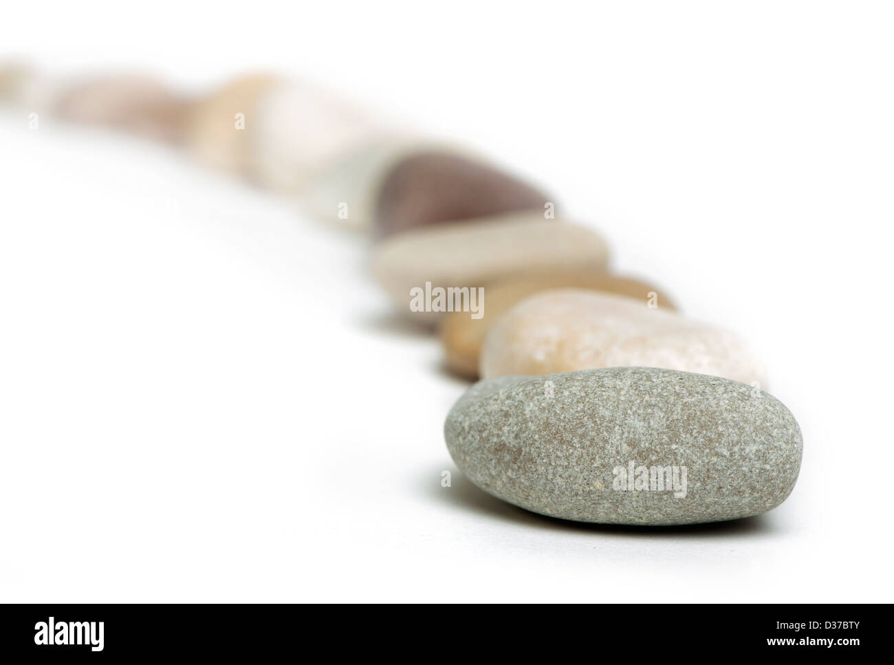 Stacked stones white isolated. Studio shot . Stock Photo