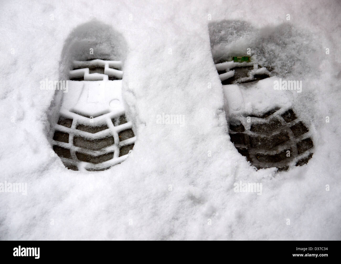 Footprints in the snow Stock Photo Alamy