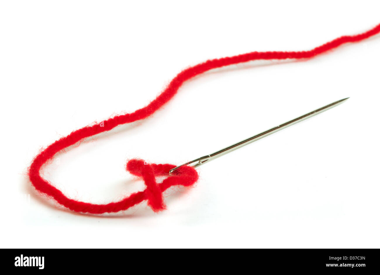 Sewing needle and red thread close up. White isolated Stock Photo Alamy